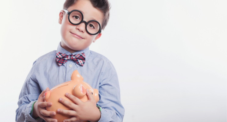 child holding piggy bank