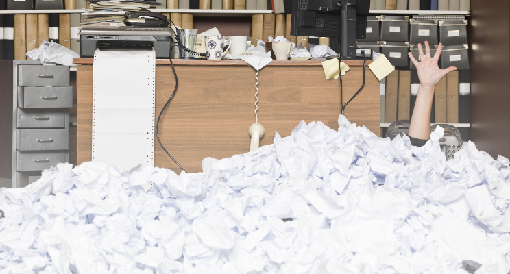 person buried in paper