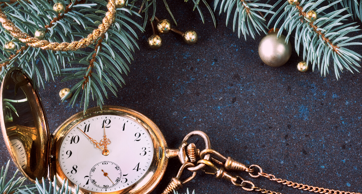 pocket watch next to christmas tree