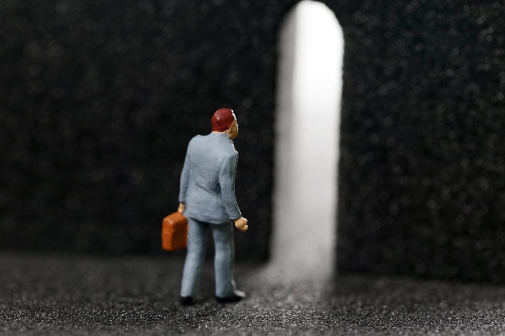 man going through arch way