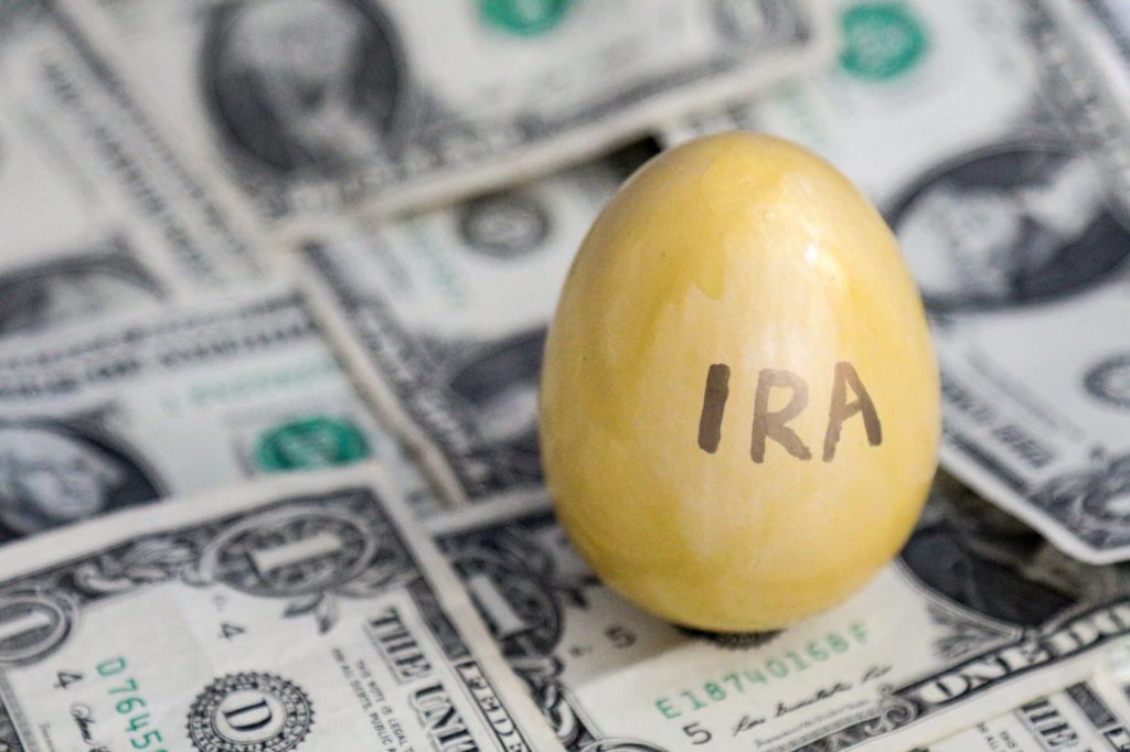 egg on top of money with IRA written on front