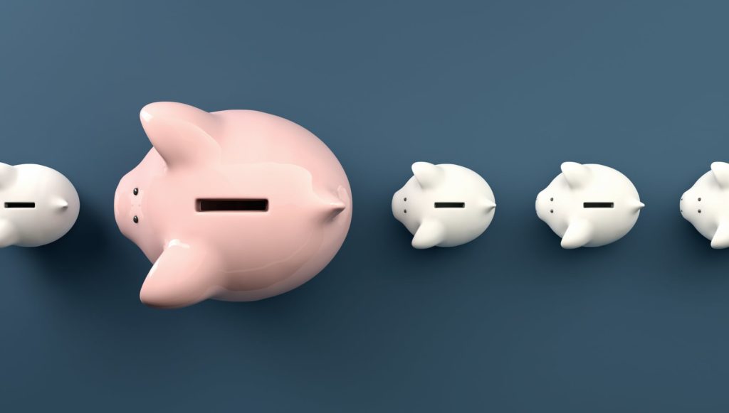 large piggy bank with baby piggy banks in line