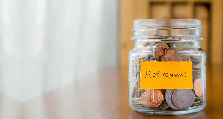 jar of money with retirement note on front