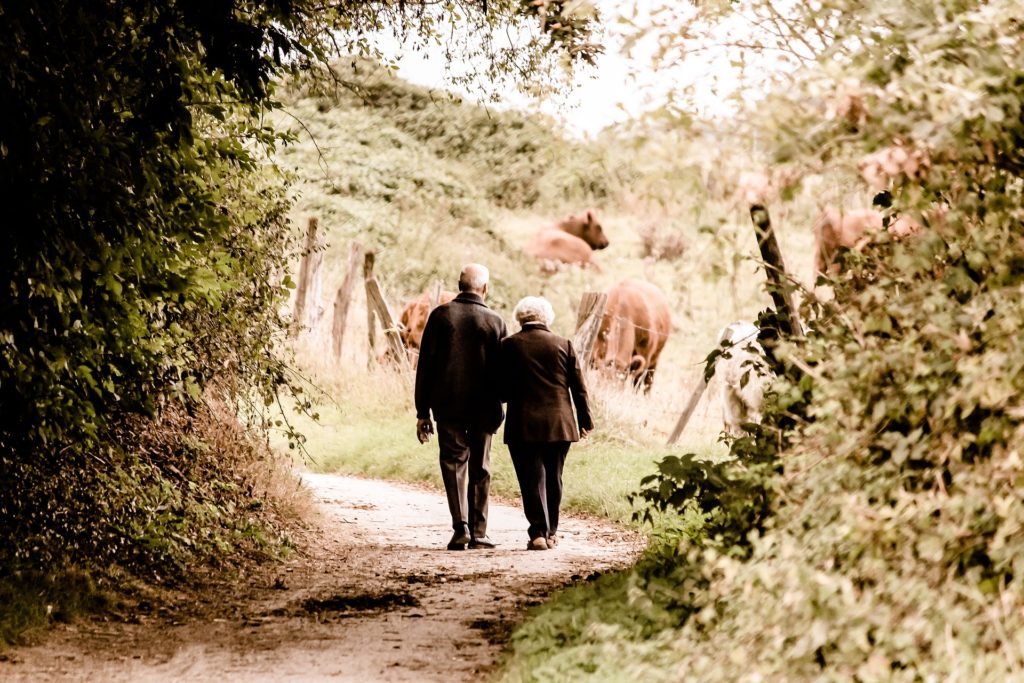 couple walking down trail